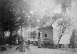 1889 House with family out front