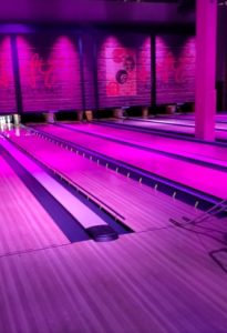 pic of Leftys bowling alley with purple tint from lights