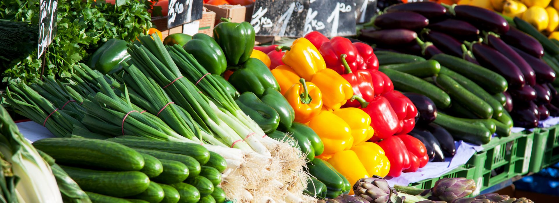 Rows of bright colored fruits and vegetables