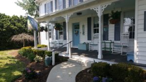 Picture of the front porch of the house as it has been updated 2019