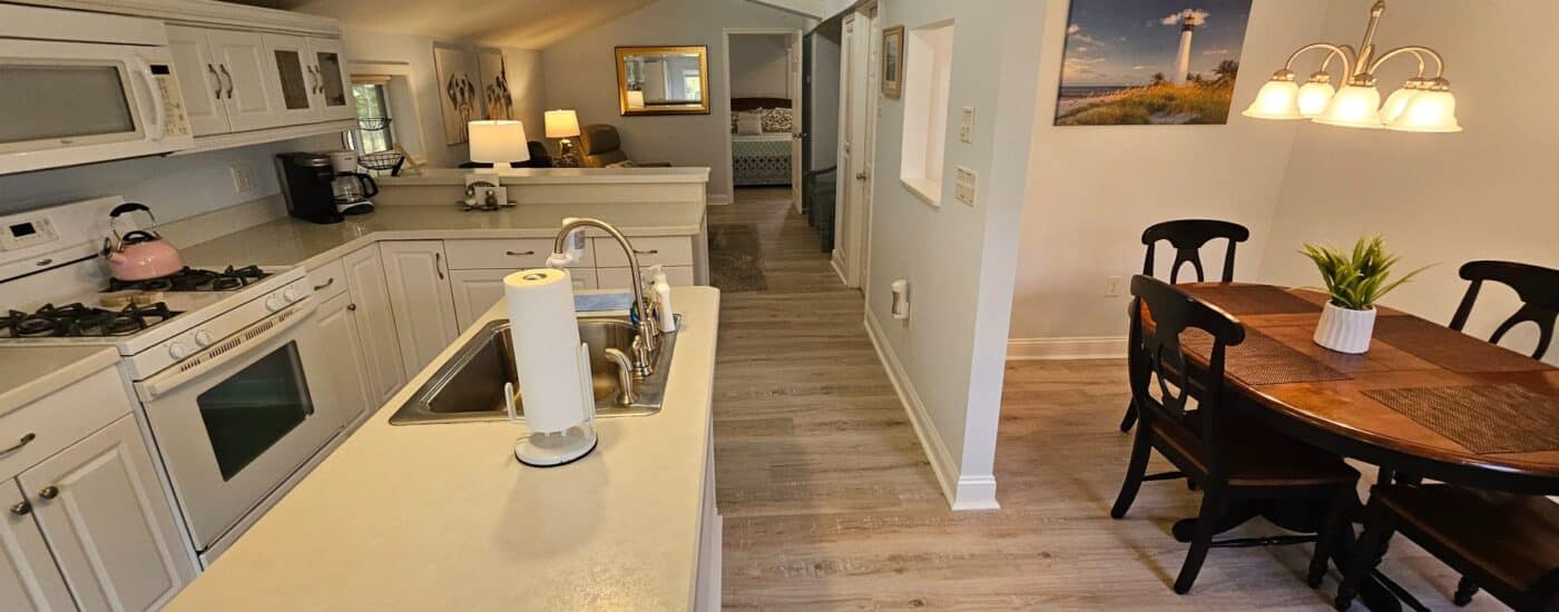 shot of the white kitchen and light colored wood floors