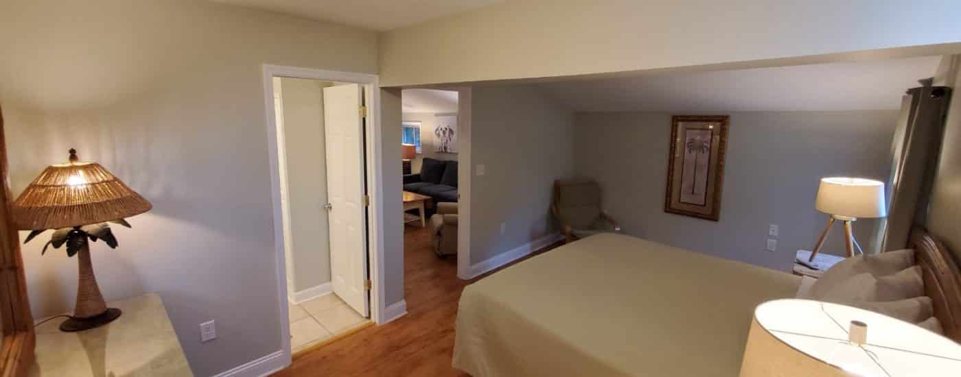 Hardwood floors, green bedspread