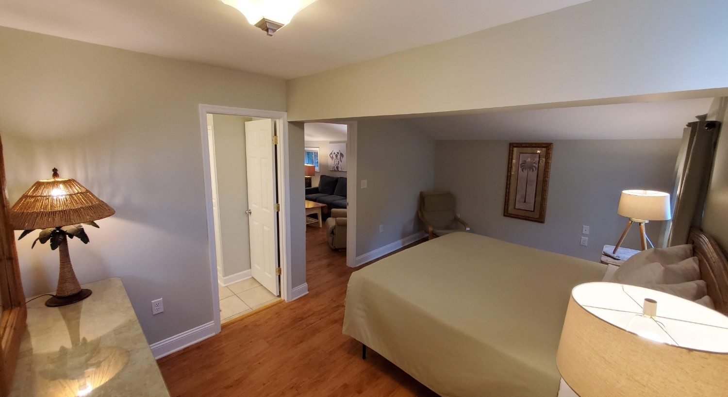 Hardwood floors, green bedspread