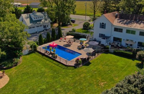 drone view of back yard and pool