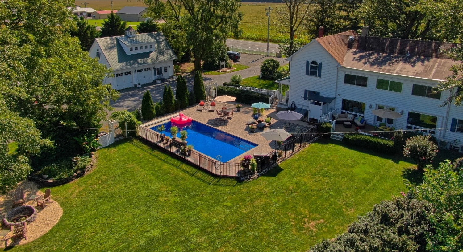 drone view of back yard and pool