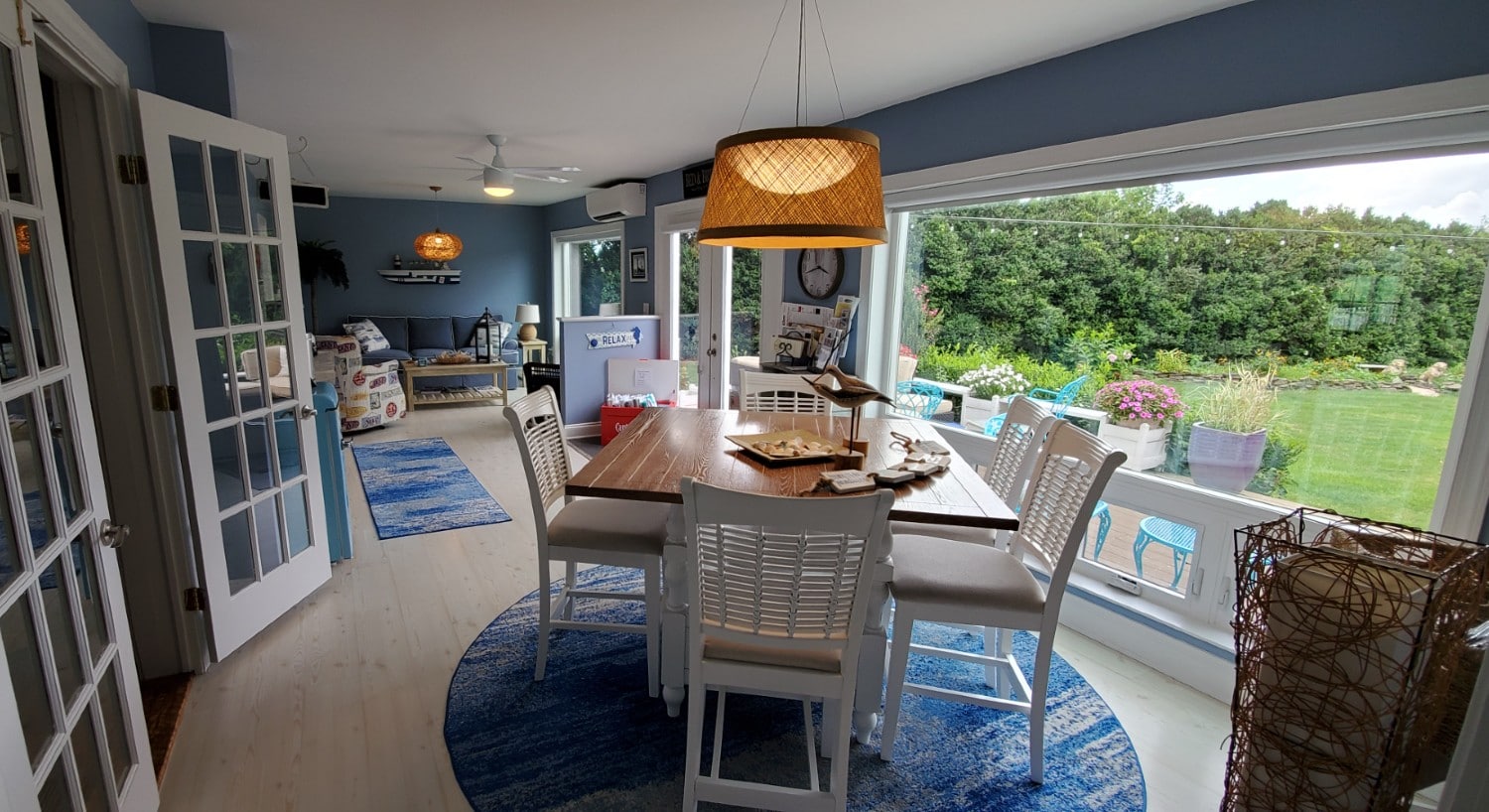 Blue sunporch  with hanging wicker lights