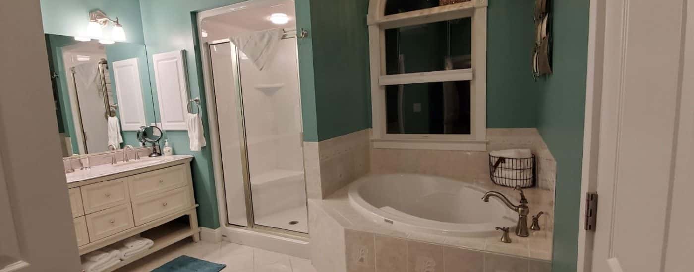 double sink bathroom with white soaking tub