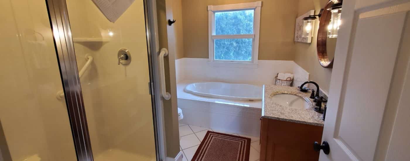 tan walls with white counter and soaking tub