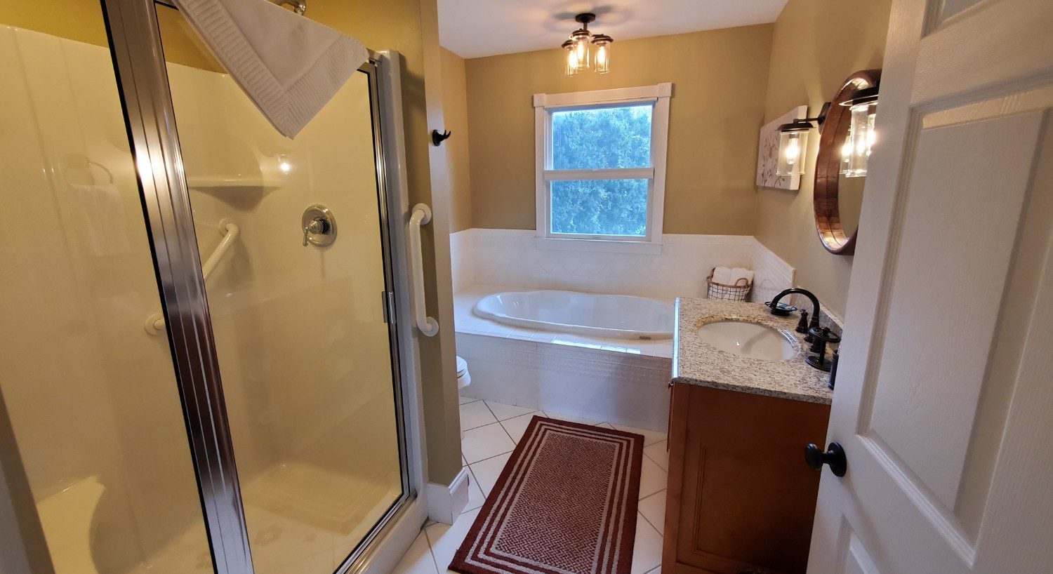 tan walls with white counter and soaking tub