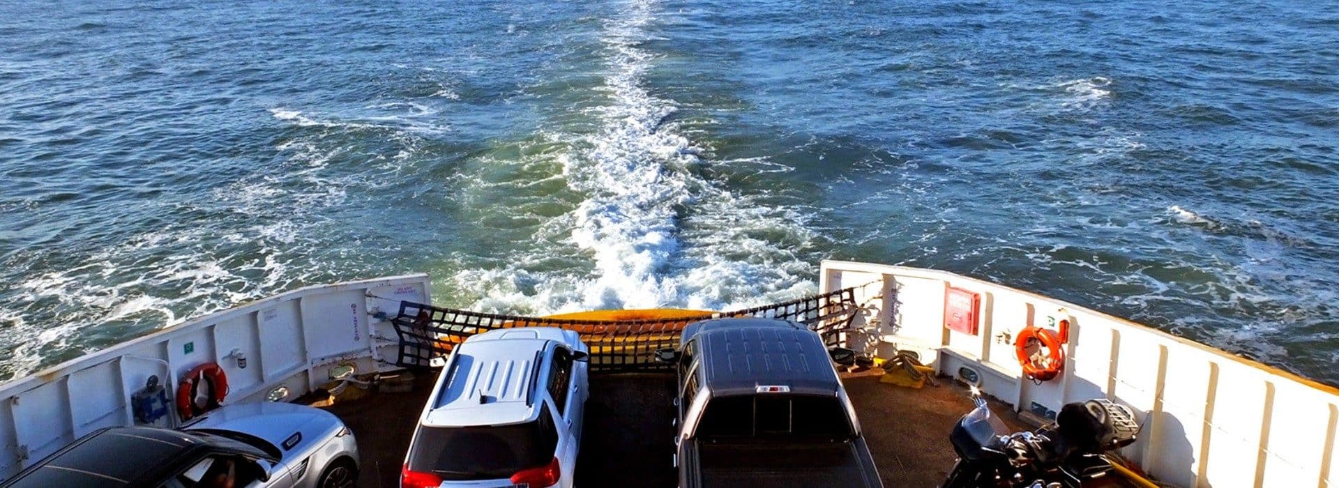 back of a ferry with cars on it