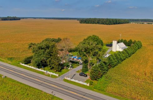 drone up hight showing front of house and property