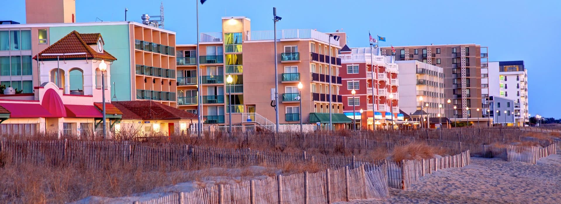 View of Rehoboth Beach from the water with colorful buildings along the beachfront.