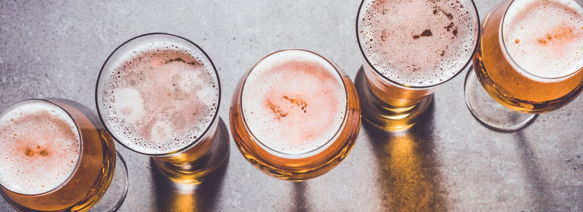 Top view of 4 glasses of beer in glasses