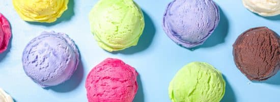 Single scoops of different colorful ice cream flavors.
